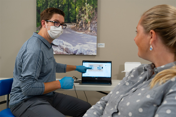 Dentist speaking with a patient at Fiorenza Dental Group